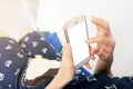Asian Pregnant woman is sleeping and play smartphone by using finger touch to white blank screen of smartphoneAsian Pregnant woman Royalty Free Stock Photo