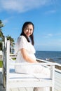Asian pregnant women sitting near the sea Royalty Free Stock Photo