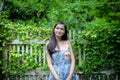 Asian pretty girl has relaxing with happy and smiling at Little Tree Garden cafe, Nakhon Pathom province, Thailand in the morning Royalty Free Stock Photo