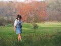 Pretty girl walking and dancing through a green field, summer outdoor Royalty Free Stock Photo