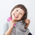 Asian pretty little girl singing with microphone, asian small girl, toddler Royalty Free Stock Photo