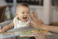 Asian pretty lovely baby girl playing give Hi5 hand touched with her parents Royalty Free Stock Photo