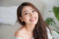 Asian pretty young woman relaxing at home. Royalty Free Stock Photo