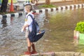 Asian primary students wear various medical masks and backpacks to protect and safety themselves from Coronavirus Covid-19 in