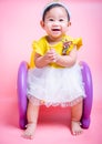 Asian princess little baby girl sitting on chair she is smile in studio