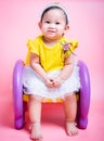 Asian princess little baby girl sitting on chair she is smile