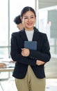 Asian professional successful female businesswoman entrepreneur manager ceo in formal business suit smiling standing posing Royalty Free Stock Photo