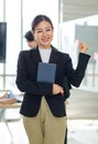 Asian professional successful female businesswoman entrepreneur manager ceo in formal business suit smiling standing posing Royalty Free Stock Photo