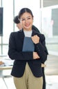 Asian professional successful female businesswoman entrepreneur manager ceo in formal business suit smiling standing posing Royalty Free Stock Photo