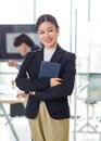 Asian professional successful female businesswoman entrepreneur manager ceo in formal business suit smiling standing posing Royalty Free Stock Photo