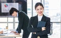 Asian professional successful female businesswoman entrepreneur manager ceo in formal business suit smiling standing posing Royalty Free Stock Photo