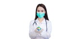 Asian professional woman doctor wears medical coat face mask and rubber glove while holds global ball as sign save the world Royalty Free Stock Photo