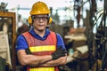 Asian Professional worker standing arm cross in heavy industry working in factory production line process with eyes and ears