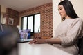 Asian programmer using software app with encryption Royalty Free Stock Photo
