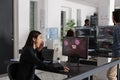 Asian it programmer reading critical errors on computer display