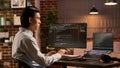 Asian programmer using binary code to script security system Royalty Free Stock Photo