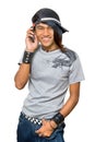 Asian punker calling by cell phone Royalty Free Stock Photo