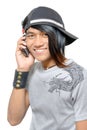 Asian punker calling by cell phone Royalty Free Stock Photo