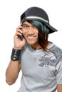 Asian punker calling by cell phone Royalty Free Stock Photo