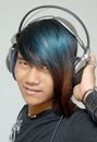 Asian punker portrait with headphones Royalty Free Stock Photo