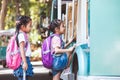 Asian pupil kids with backpack holding hand and going to school Royalty Free Stock Photo