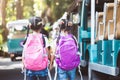 Asian pupil kids with backpack holding hand and going to school Royalty Free Stock Photo