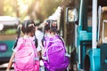 Asian pupil kids with backpack holding hand and going to school Royalty Free Stock Photo