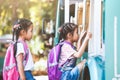 Asian pupil kids with backpack holding hand and going to school Royalty Free Stock Photo