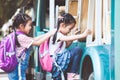 Asian pupil kids with backpack holding hand and going to school Royalty Free Stock Photo