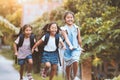 Asian pupil kids with backpack running Royalty Free Stock Photo