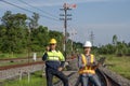 Asian railway engineer inspects a train station Engineer working on maintenance inspection in railway station Royalty Free Stock Photo