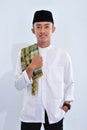 Asian religious muslim man of indonesia smile at you