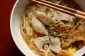 Asian rice noodle soup with pork, fish ball and crisps dumpling.