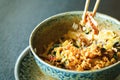 Asian rice with pork, Mu-err mushrooms, napa cabbage, pickled bamboo shoots, spinach, Teriyaki, sweet chili sauce, onion Royalty Free Stock Photo