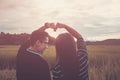 Asian,Romantic couple or Homosexuality, female love open arm , Heart signs happy on rice field with sunset, Valentine`s Day love