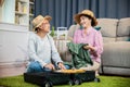 Asian romantic retired couple packing clothes travel bag suitcase together on Royalty Free Stock Photo