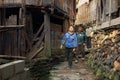 Asian rural, peasant, farmer, kids teens walk around Chinese village.