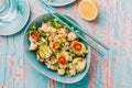 Asian salad with roasted cauliflower, cucumber, onion and chili