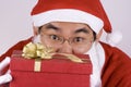Asian Santa Claus With Present