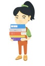 Asian school child holding pile of textbooks. Royalty Free Stock Photo