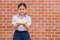 Asian school girl looking at two palm amazing thing in hand show present education concept Royalty Free Stock Photo