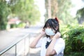 Asian school girl with mask in walkway city Royalty Free Stock Photo