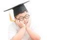 Asian school kid graduate bored with graduation cap isolated Royalty Free Stock Photo