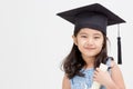 Asian school kid graduate in graduation cap Royalty Free Stock Photo