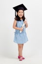 Asian school kid graduate in graduation cap Royalty Free Stock Photo