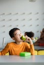asian schoolboy eating apple in school Royalty Free Stock Photo