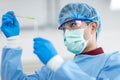 Asian scientists wear protective clothing while doing medical research Royalty Free Stock Photo