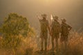 Asian scout leader stands and points out the long-distance targets for the scouts in the team for the next day`s journey near