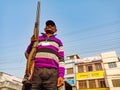 An asian security guard holded gun on road in india oct 2019