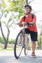 Asian Senior adult man riding bicycle in park Royalty Free Stock Photo